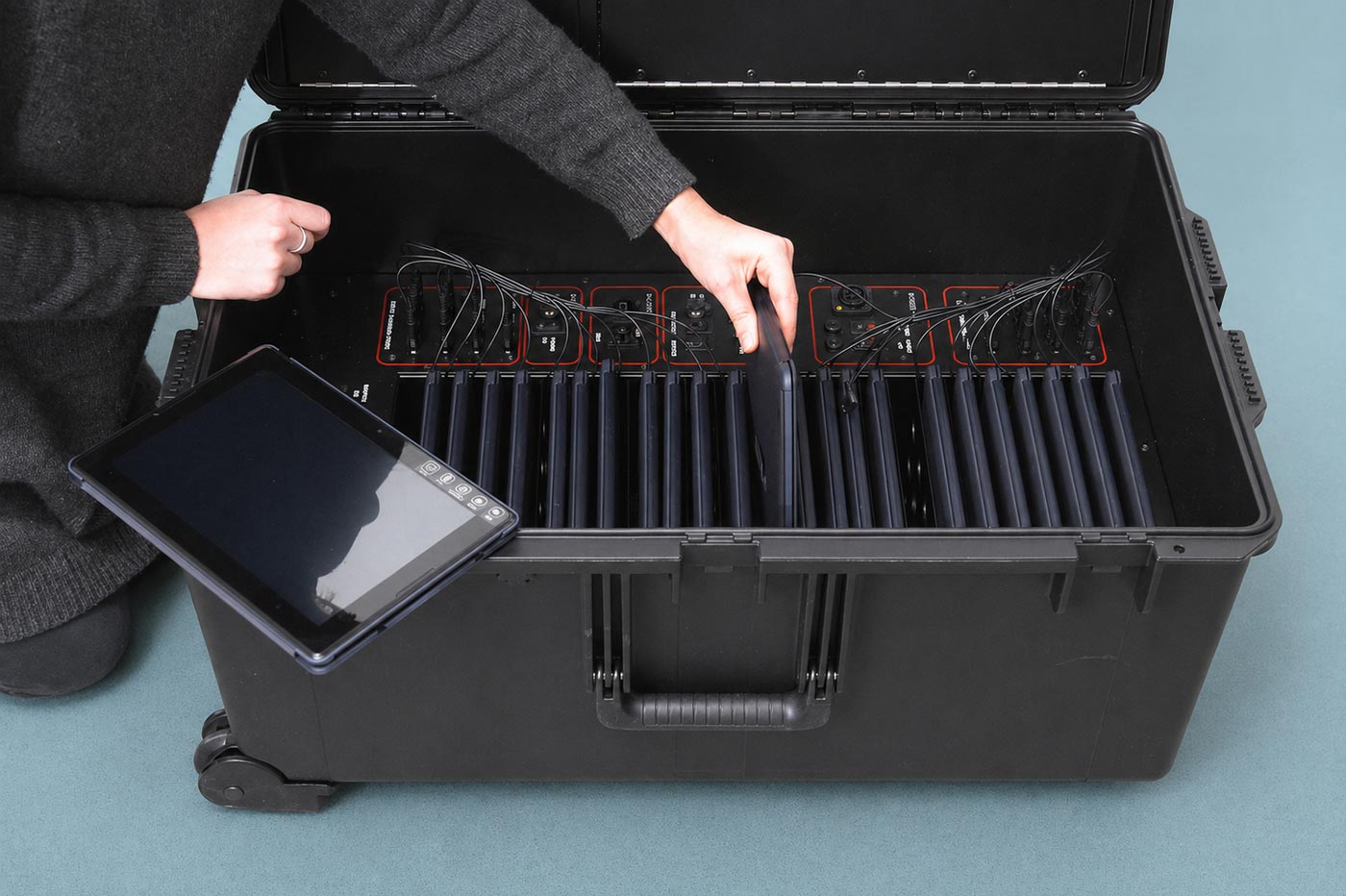Internal layout of Instant Classroom case showing tablets and teaching equipment